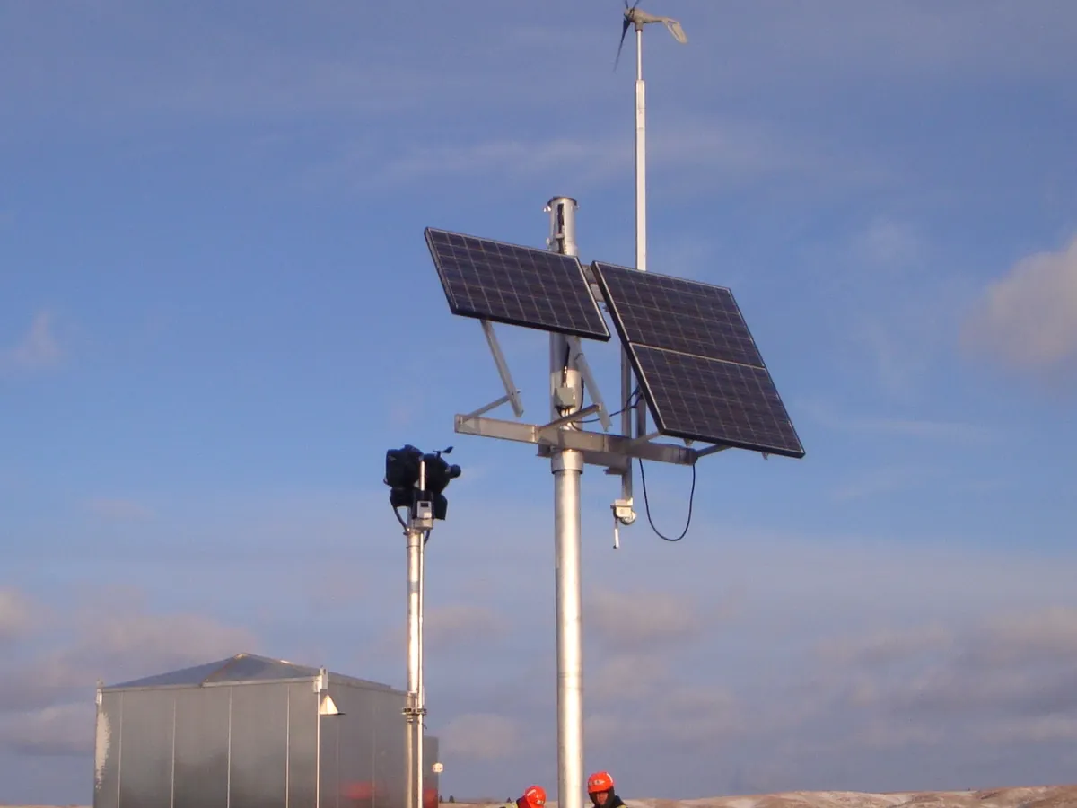 TF-2A 4X4 foundation supporting a pole-mounted solar array at a rail wayside site