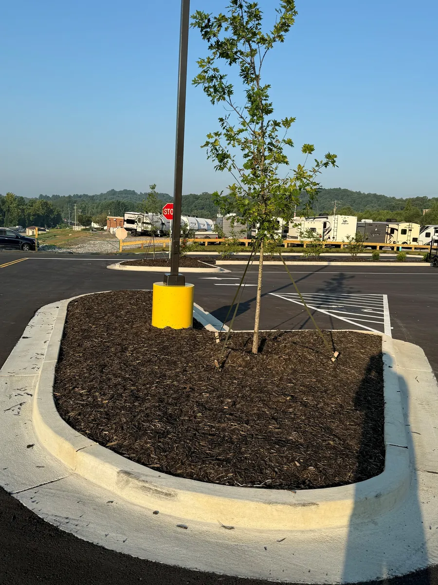 Precast pole base installed for parking lot lighting at Tractor Supply, Dahlonega, Georgia