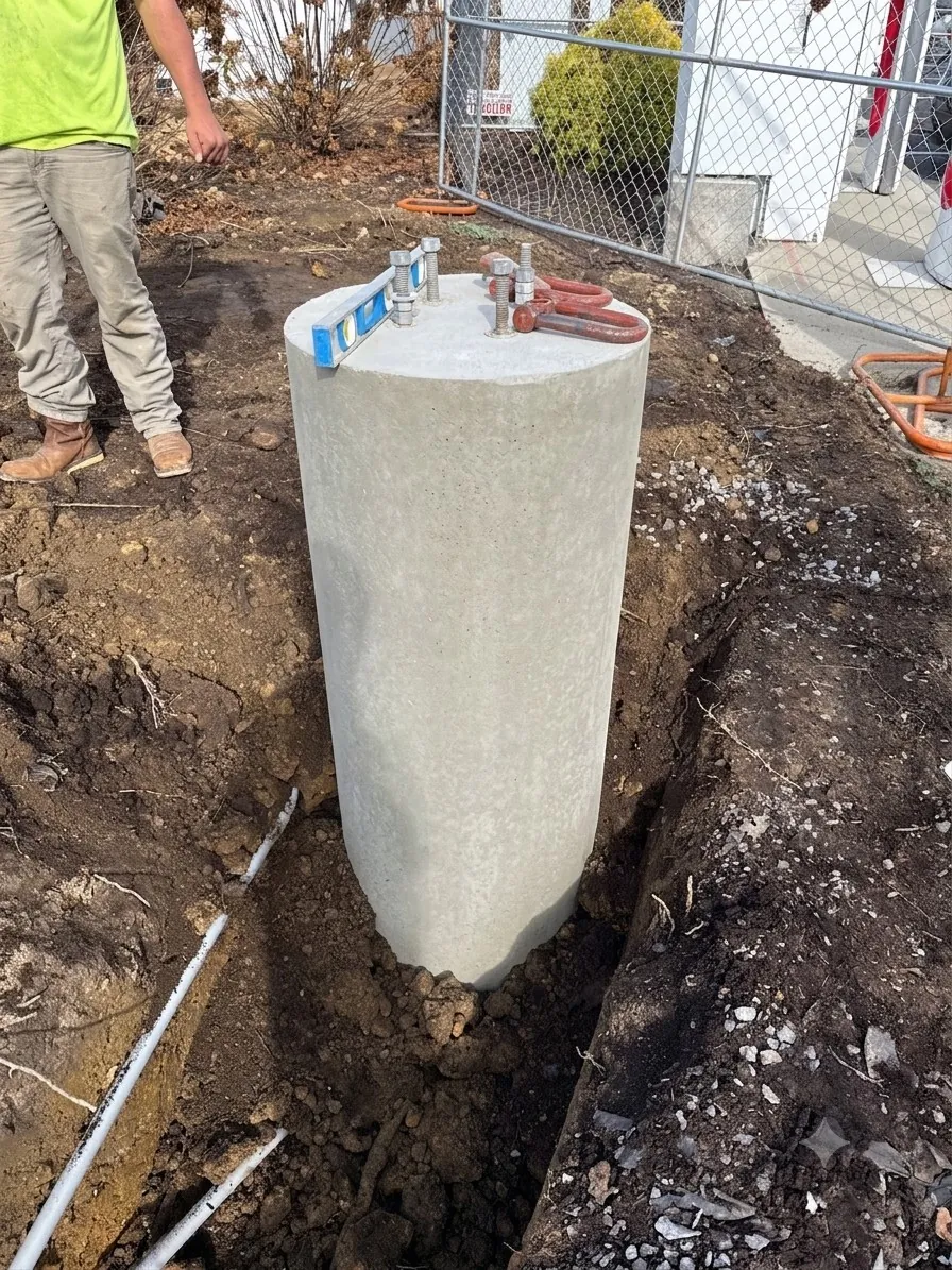 Precast pole base supporting a light pole in Pigeon Forge, Tennessee
